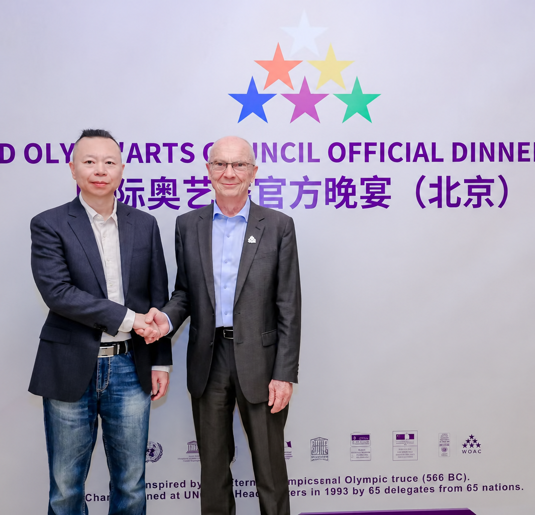Zhaohui Hu with Marc Verrière after attending an official international Olympic arts dinner.